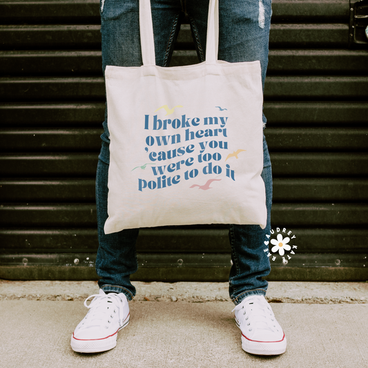 Double-sided natural cotton tote bag, one side has sunglasses with 1989 inside; the other says I broke my heart cause you were too polite to do it with 5 seagulls by audreykaterae