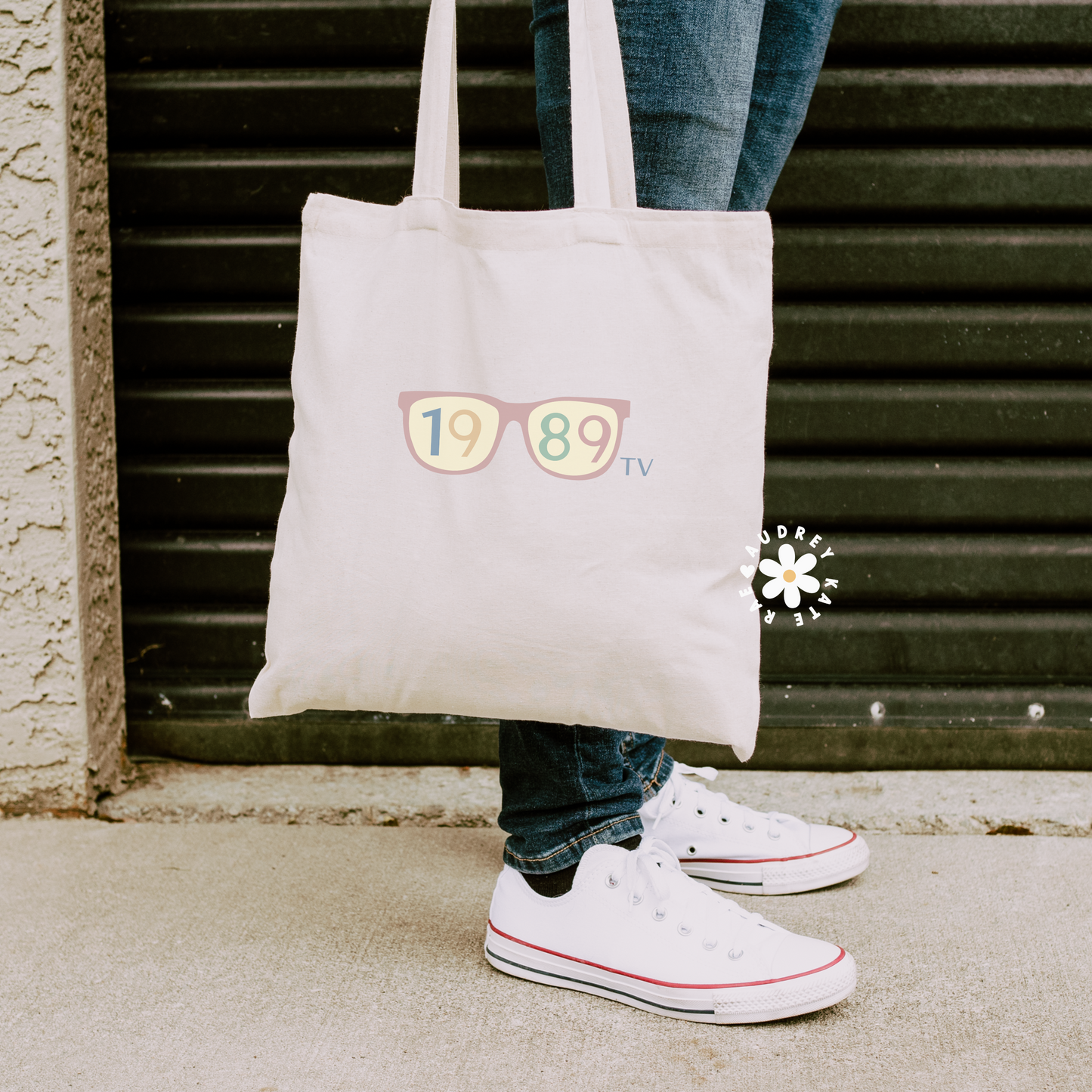 Double-sided natural cotton tote bag, one side has sunglasses with 1989 inside; the other says I broke my heart cause you were too polite to do it with 5 seagulls by audreykaterae